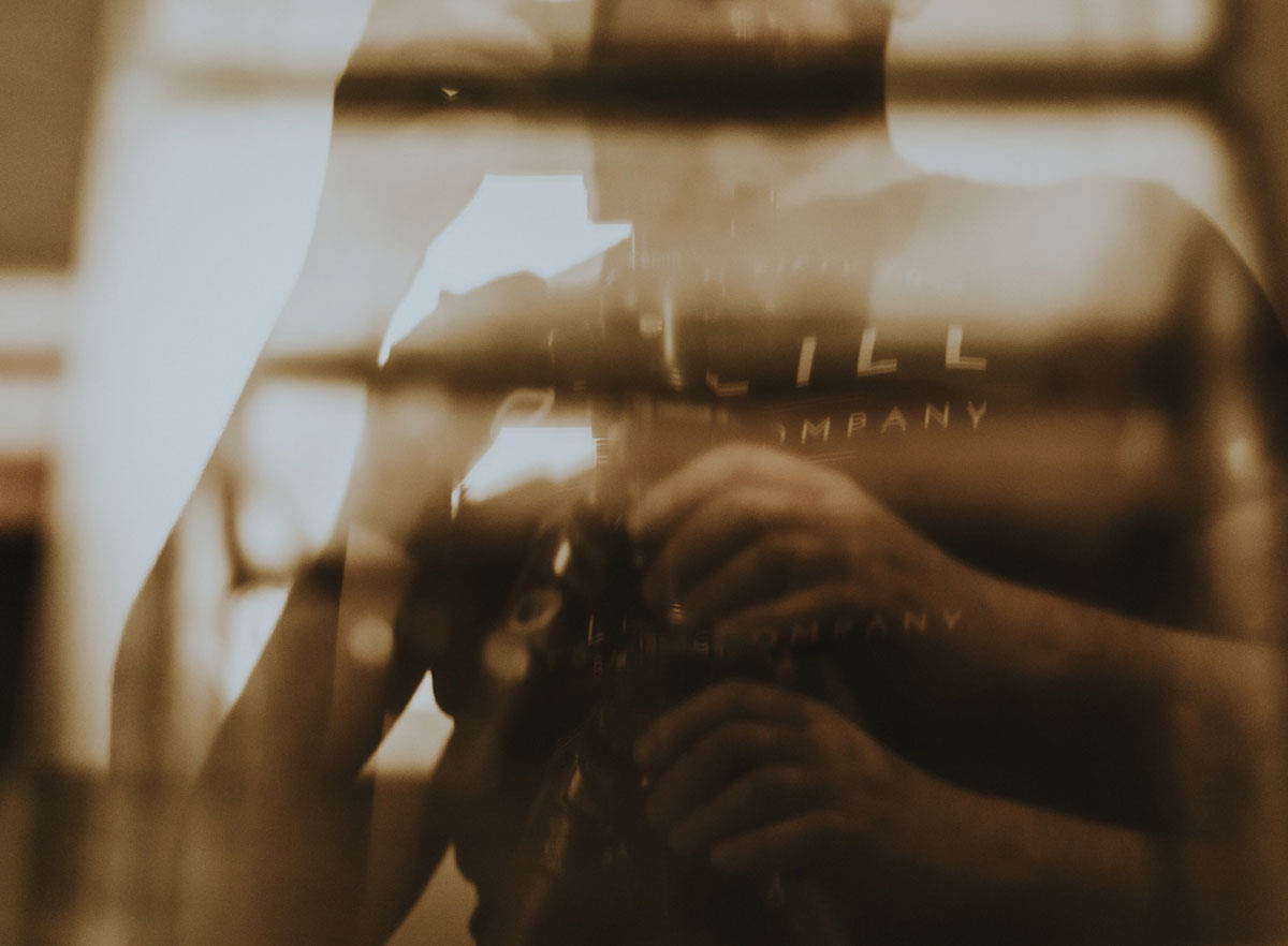 abstract sepia tone photo of a man split into a transparent image of himself