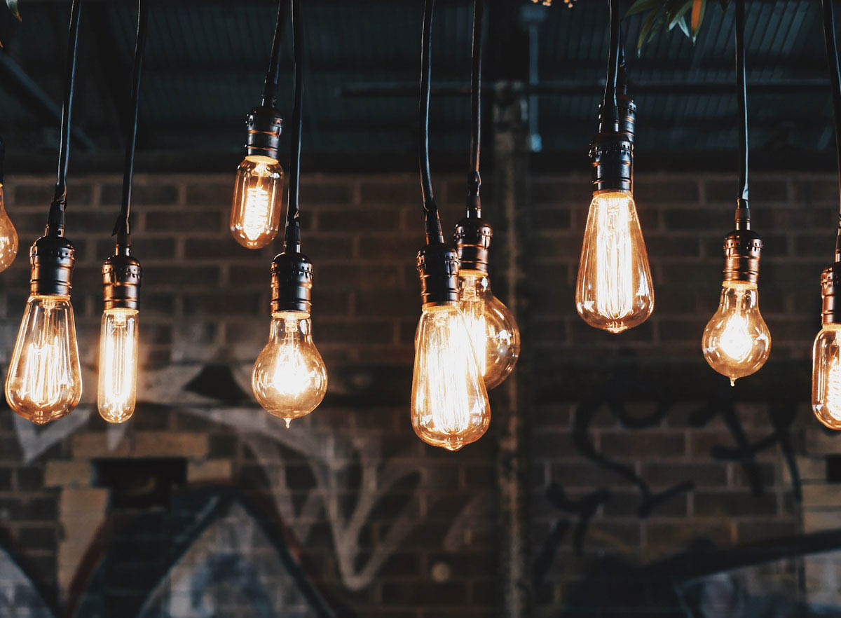 many lightbulbs hanging representing ideas